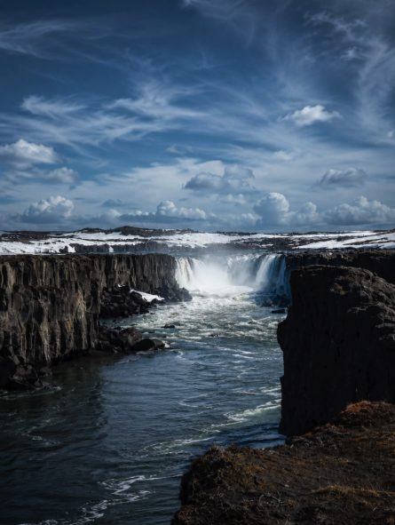 Selfoss with snow still lying on the canyon rim